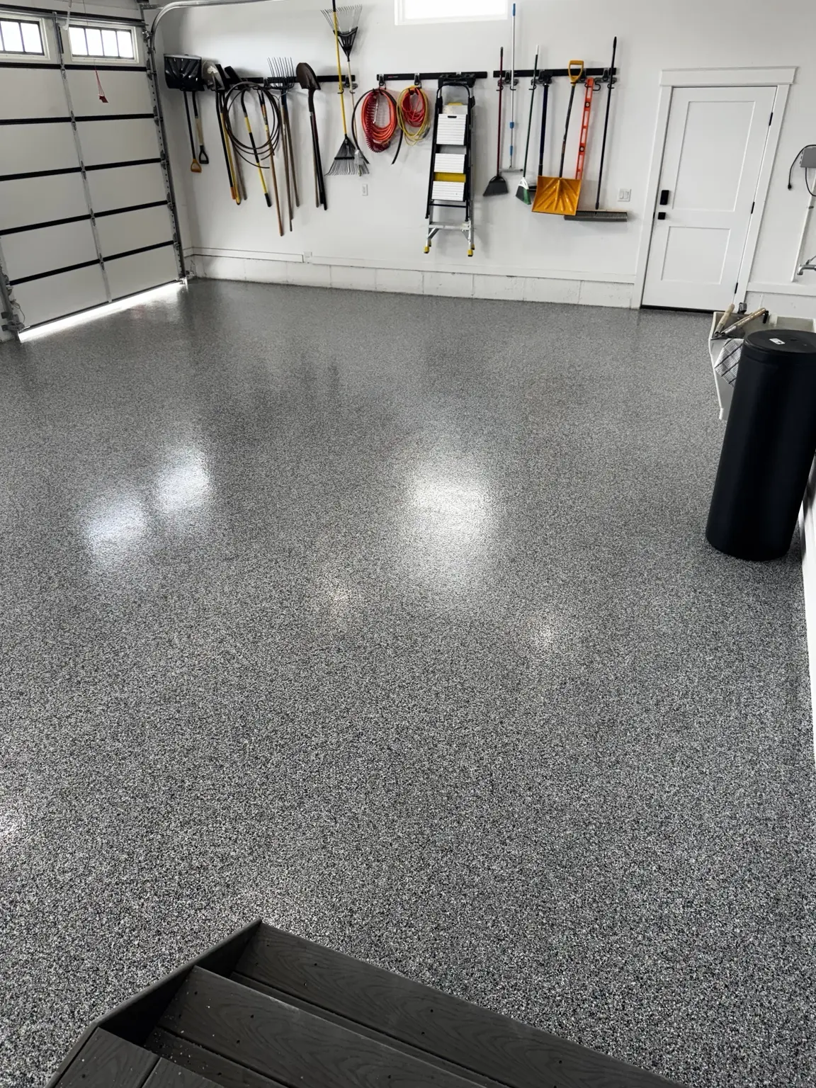 Decorative gray flake garage floor coating in an organized Ogden garage