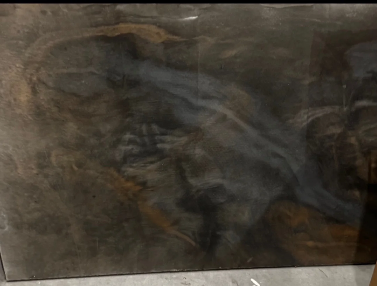 Custom bronze and charcoal metallic epoxy with organic marble movement